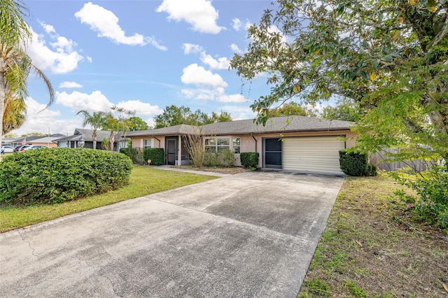 ranch-style home featuring a front lawn and driveway