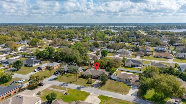 birds eye view of property with a residential view