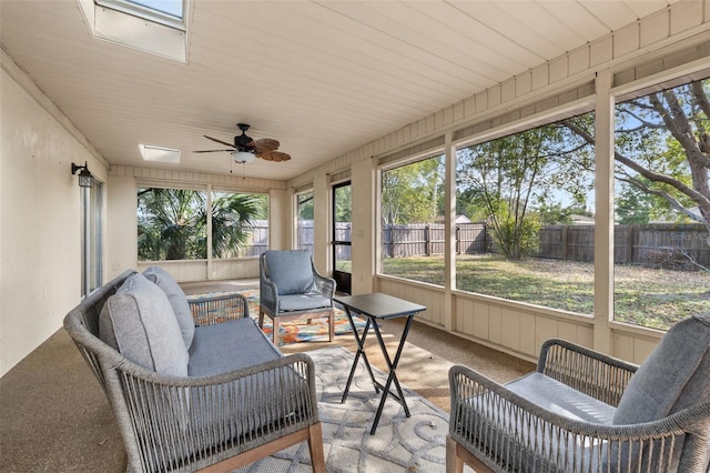 sunroom / solarium with a skylight and ceiling fan