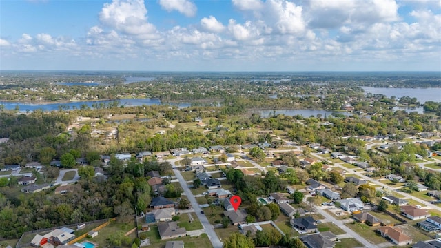 birds eye view of property featuring a water view and a residential view