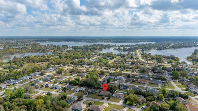 birds eye view of property with a residential view and a water view