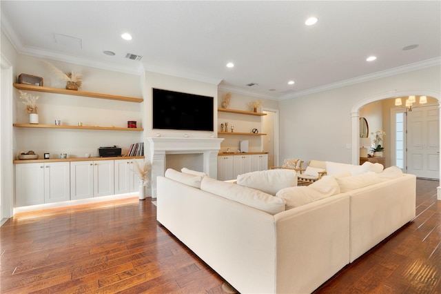 living room with visible vents, ornamental molding, dark wood-style floors, recessed lighting, and arched walkways