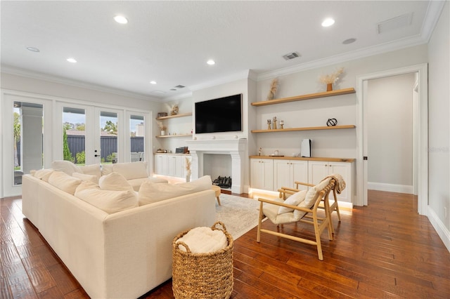 living area featuring recessed lighting, french doors, dark wood-type flooring, and crown molding