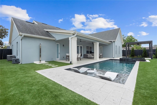 back of house with ceiling fan, a yard, an outdoor hangout area, and a fenced backyard