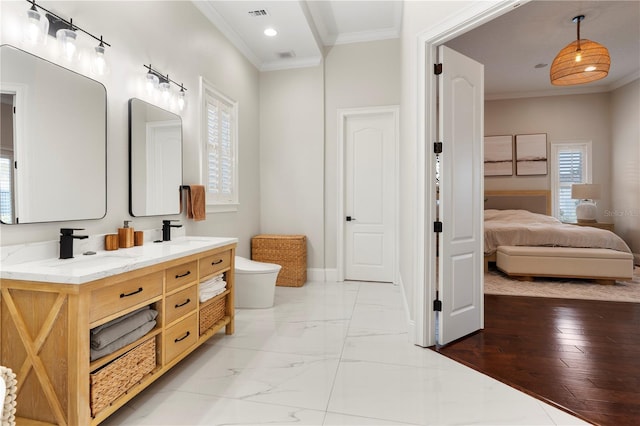 bathroom featuring marble finish floor, visible vents, ensuite bathroom, and ornamental molding