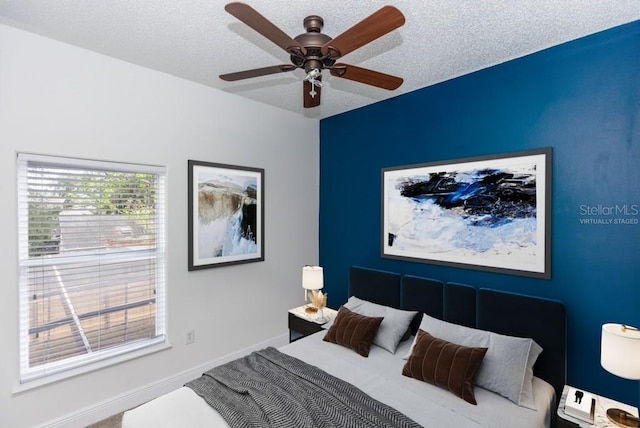 2217 Wekiva Reserve Blvd, Apopka, FL 32703 - bedroom featuring a textured ceiling, a ceiling fan, and baseboards