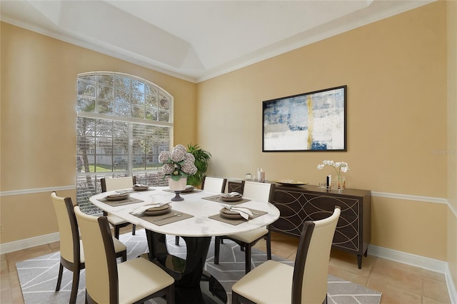 dining space with light tile patterned flooring and baseboards