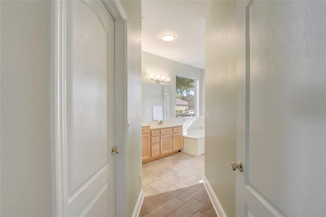 full bathroom with vanity and a garden tub