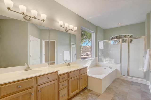 bathroom featuring a shower stall, a bath, double vanity, and a sink