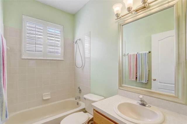 bathroom featuring tub / shower combination, toilet, and vanity