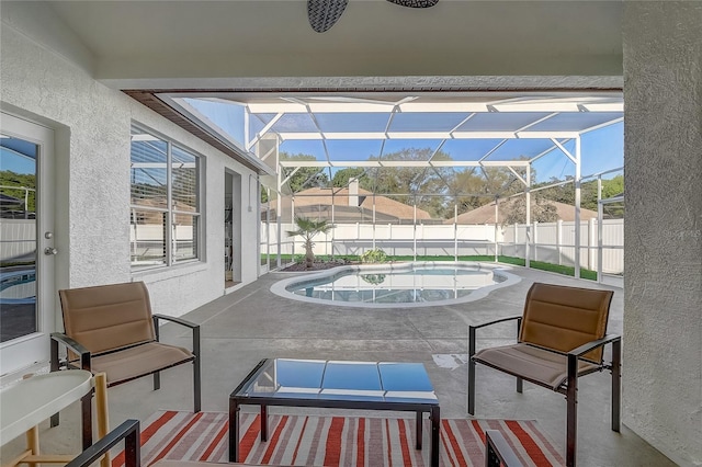 view of patio featuring a lanai, a fenced in pool, and a fenced backyard