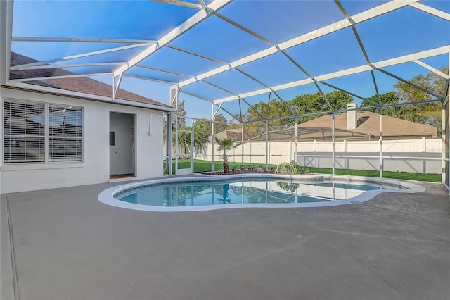 view of pool featuring a lanai, a fenced in pool, a fenced backyard, and a patio area