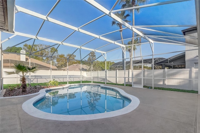 view of swimming pool with a lanai, a fenced in pool, a patio, and a fenced backyard