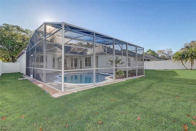 view of swimming pool with a patio, a fenced in pool, a fenced backyard, and a lawn