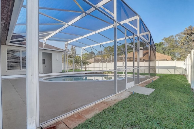 view of pool featuring glass enclosure, a yard, a fenced backyard, and a fenced in pool