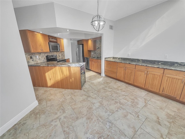 kitchen featuring visible vents, dark stone counters, stainless steel appliances, brown cabinets, and backsplash