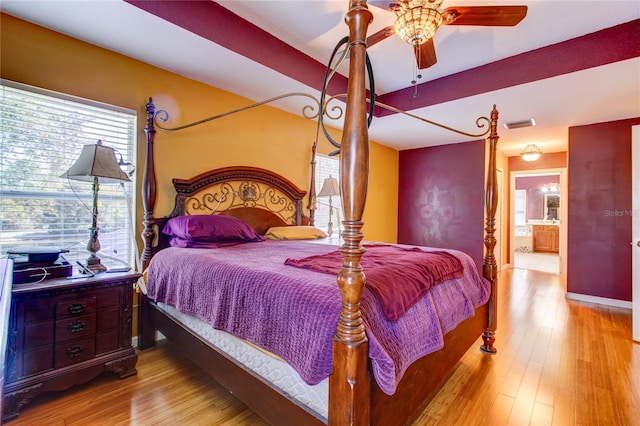 bedroom featuring baseboards and wood finished floors