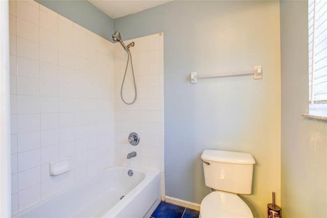 full bath featuring toilet, baseboards, and shower / bath combination