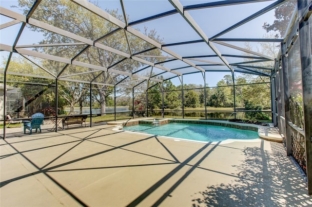 view of swimming pool featuring a patio, a pool with connected hot tub, and a lanai