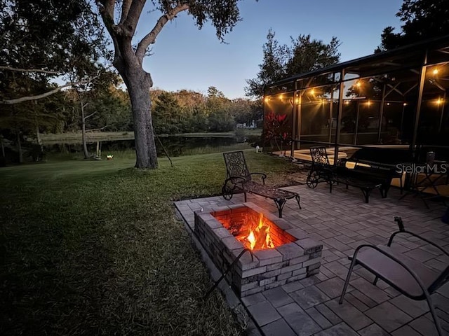 view of patio featuring an outdoor fire pit