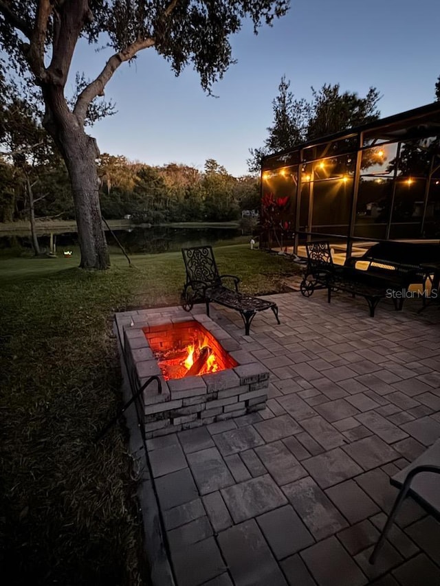 view of patio with a fire pit