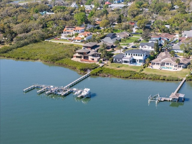 drone / aerial view featuring a residential view and a water view