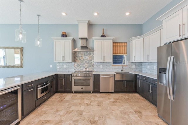 kitchen featuring a sink, wine cooler, appliances with stainless steel finishes, and white cabinets