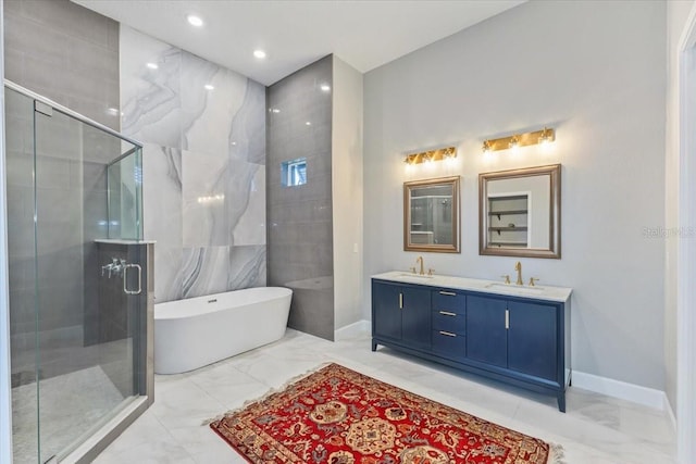 full bath with marble finish floor, a stall shower, a sink, double vanity, and a freestanding bath