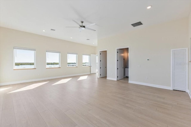 unfurnished room with a ceiling fan, baseboards, visible vents, recessed lighting, and light wood-type flooring