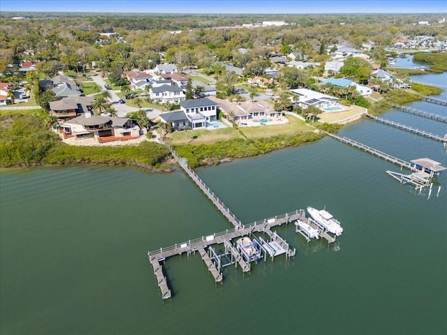 drone / aerial view with a residential view and a water view