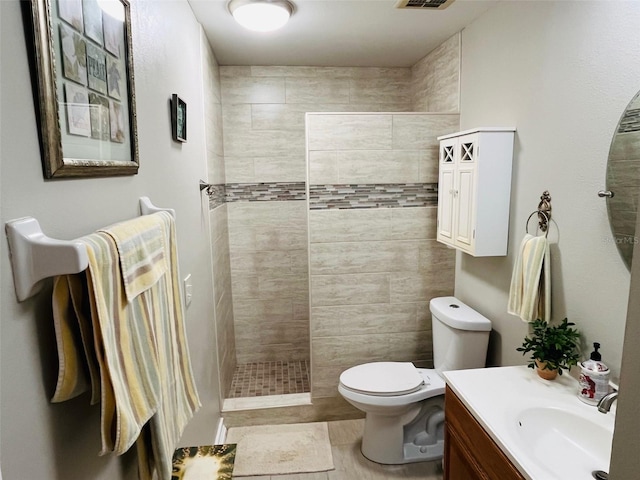 full bath featuring visible vents, toilet, vanity, and walk in shower