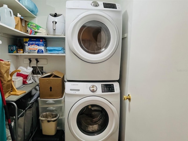 laundry area featuring laundry area and stacked washer / drying machine