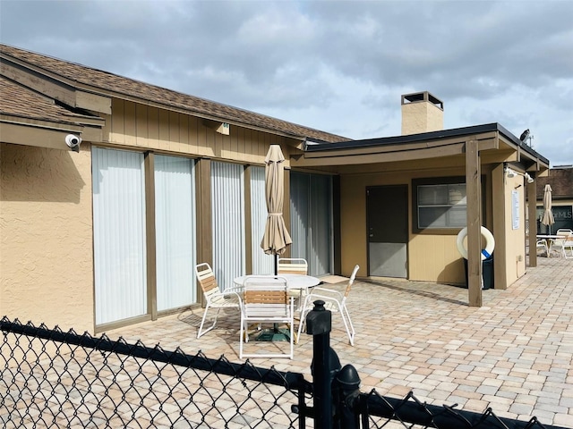 view of patio featuring fence