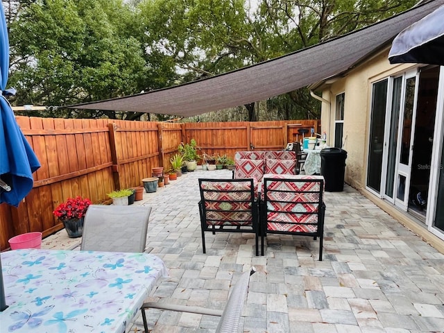 view of patio / terrace with outdoor dining area and a fenced backyard