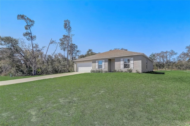 view of front of property with stucco siding, concrete driveway, a front yard, and a garage