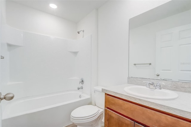 bathroom with shower / bath combination, toilet, and vanity