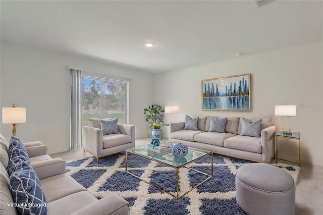 living room featuring recessed lighting and visible vents