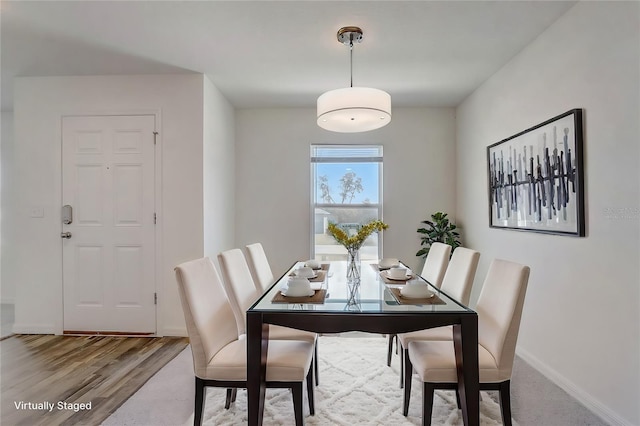 dining room with wood finished floors and baseboards