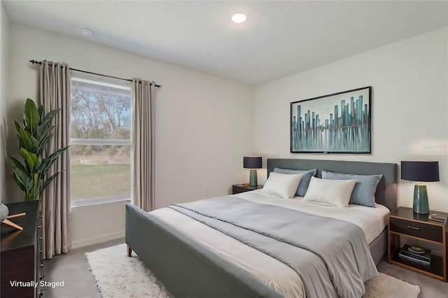 carpeted bedroom featuring baseboards