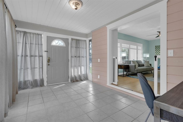 tiled entryway with wooden ceiling and ceiling fan