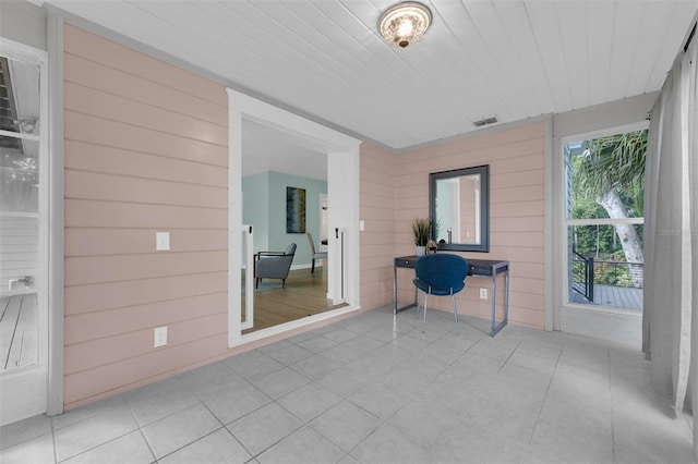 unfurnished sunroom with visible vents and wooden ceiling