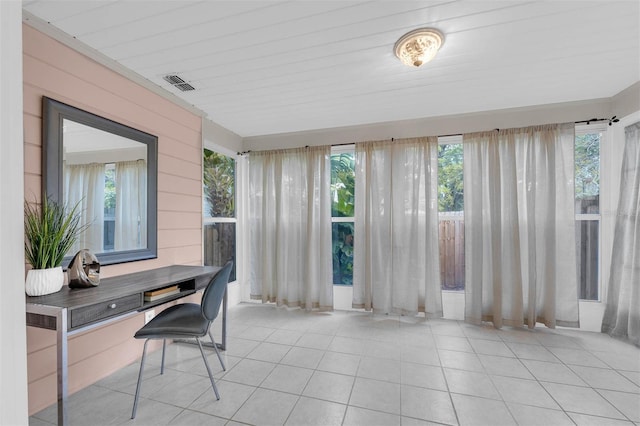 sunroom with visible vents and a wealth of natural light