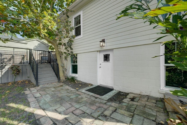 property entrance with a patio area