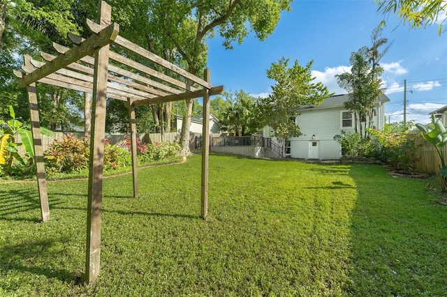 view of yard featuring a pergola and a fenced backyard