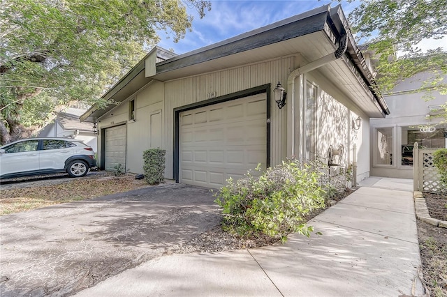 1318 Chebon Ct Unit E-F, Unit E-F, Apopka, FL 32712 - view of property exterior with a garage and aphalt driveway