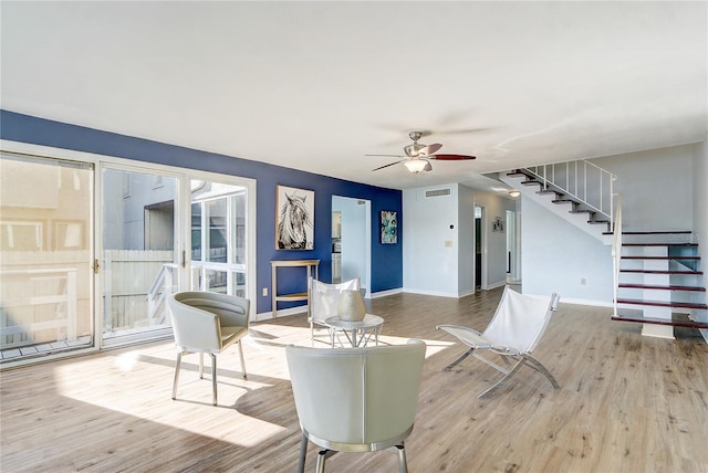1318 Chebon Ct Unit E-F, Unit E-F, Apopka, FL 32712 - living room with a ceiling fan, visible vents, stairway, and wood finished floors