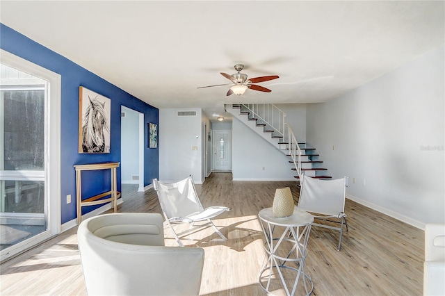 1318 Chebon Ct Unit E-F, Unit E-F, Apopka, FL 32712 - interior space featuring stairway, a ceiling fan, visible vents, baseboards, and wood finished floors