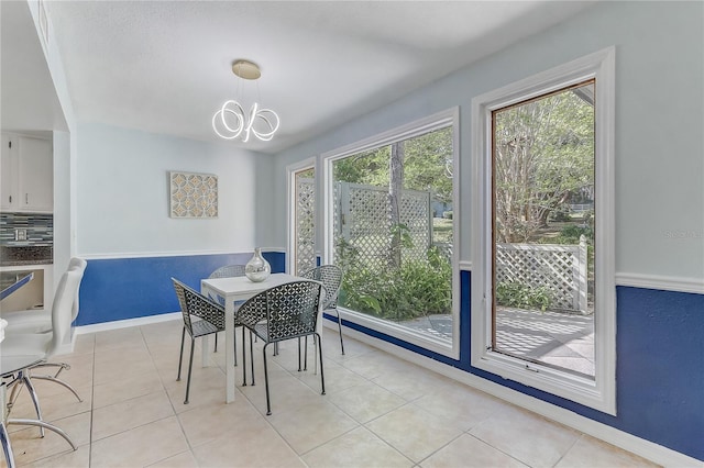 1318 Chebon Ct Unit E-F, Unit E-F, Apopka, FL 32712 - dining space with light tile patterned flooring, a notable chandelier, and baseboards