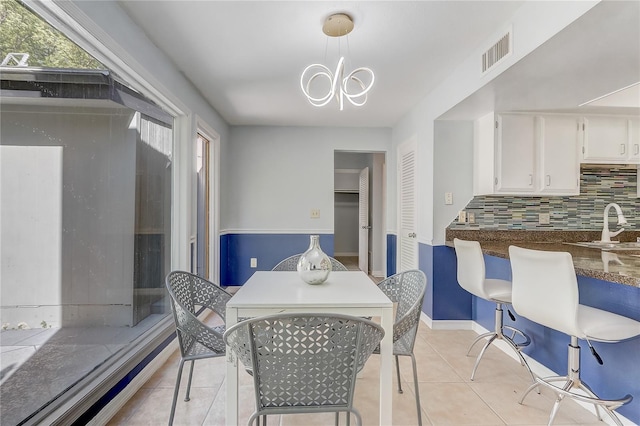 1318 Chebon Ct Unit E-F, Unit E-F, Apopka, FL 32712 - dining space with visible vents, light tile patterned floors, an inviting chandelier, and plenty of natural light