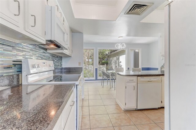 1318 Chebon Ct Unit E-F, Unit E-F, Apopka, FL 32712 - kitchen featuring tasteful backsplash, white cabinets, visible vents, light tile patterned flooring, and white appliances